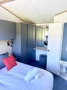 Ένα ή περισσότερα κρεβάτια σε δωμάτιο στο Caban Iago Lodge