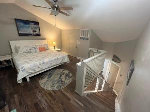 a bedroom with a bed and a ceiling fan at Surf Condos 737 in Surf City