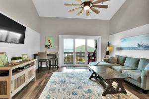 a living room with a couch and a table at Surf Condos 737 in Surf City