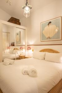 En eller flere senge i et værelse på Pajaritos Luxury by Valcambre