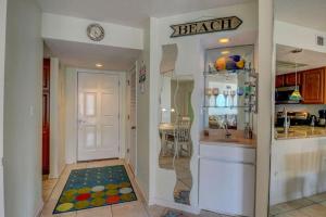 a kitchen with a counter and a sink and a kitchen with a counter at St Regis 3303 in Chadwick Acres