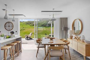 a kitchen and dining room with a table and chairs at No 6 The Vista, Willingcott, Woolacombe in Woolacombe