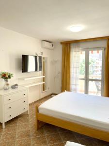 Postel nebo postele na pokoji v ubytování Jadran Apartments