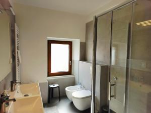 a bathroom with a toilet and a sink and a shower at Apartment Veronica - Spacious 3BR Townhouse for 6 Guests at Great Value in Brtonigla