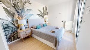 Posteľ alebo postele v izbe v ubytovaní Atico Buen Vivir en Marina Real II by Family Homes