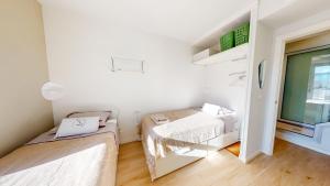 Posteľ alebo postele v izbe v ubytovaní Atico Buen Vivir en Marina Real II by Family Homes