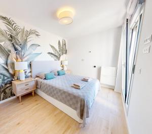 Posteľ alebo postele v izbe v ubytovaní Atico Buen Vivir en Marina Real II by Family Homes + 37 fotografií