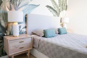 Posteľ alebo postele v izbe v ubytovaní Atico Buen Vivir en Marina Real II by Family Homes