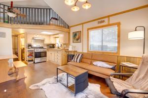 a living room with a couch and a table at Near Lake Almanor and Golf Cozy Cabin! in Lake Almanor