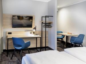 TV a/nebo společenská místnost v ubytování Hotel Purucker