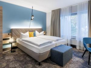 Postel nebo postele na pokoji v ubytování Hotel Purucker