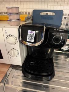 a coffee maker sitting on top of a counter at Studio Flat in Plymouth