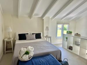 a bedroom with a large bed with towels on it at Casina Fiore - 34601 in Suesa