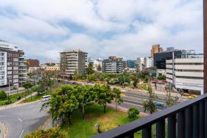 a view of a city from a balcony at Perricholi Central Apartments by Geko in Lima