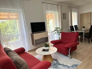 A television and/or entertainment centre at Apartmány Silvia