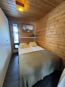 Ένα ή περισσότερα κρεβάτια σε δωμάτιο στο HIMOS Alppilumo 6 persons