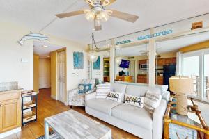a living room with a couch and a table at Belleair Beach Club 312 in Clearwater Beach