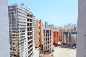 a view of a city skyline with tall buildings at 75 inch TV Sea View Balcony 12th Flr in Manama