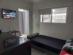 Μια τηλεόραση ή/και κέντρο ψυχαγωγίας στο Casa Aconchego