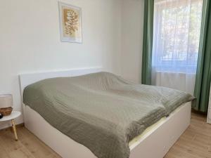 A bed or beds in a room at Apartmány Silvia
