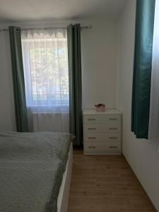 A bed or beds in a room at Apartmány Silvia