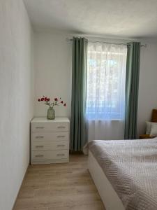 A bed or beds in a room at Apartmány Silvia