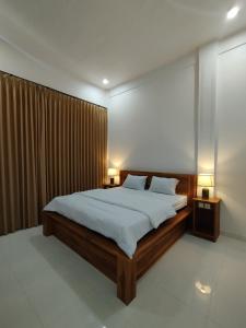 Postel nebo postele na pokoji v ubytování Nêst Guesthouse Tetebatu
