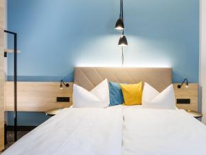 Postel nebo postele na pokoji v ubytování Hotel Purucker