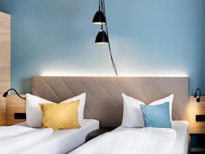 Postel nebo postele na pokoji v ubytování Hotel Purucker