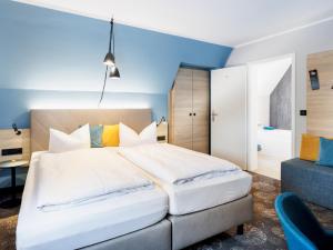 Postel nebo postele na pokoji v ubytování Hotel Purucker