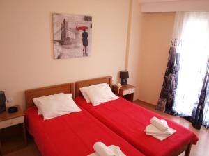 Postel nebo postele na pokoji v ubytování Efstratios Hotel