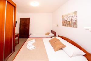 Postel nebo postele na pokoji v ubytování Jadran Apartments