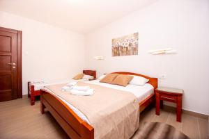 Postel nebo postele na pokoji v ubytování Jadran Apartments