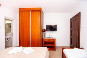 Postel nebo postele na pokoji v ubytování Jadran Apartments
