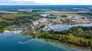 an aerial view of a marina on a lake at Ferienwohnungen Hafendorf Müritz in Rechlin