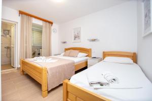 Krevet ili kreveti u jedinici u okviru objekta Jadran Apartments