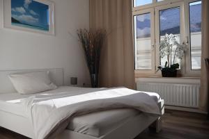 Postel nebo postele na pokoji v ubytování Hotel Astor