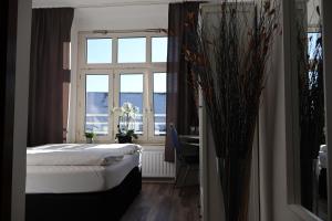 Postel nebo postele na pokoji v ubytování Hotel Astor