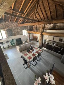 an overhead view of a living room with a table at Villa Alessio - Etna Historic Winery Villa - Ancient Palmento with pool in Puntalazzo +59 photos