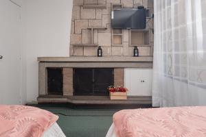 Postel nebo postele na pokoji v ubytování Innovar Casa Hostal