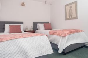 Postel nebo postele na pokoji v ubytování Innovar Casa Hostal