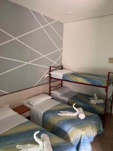 Postel nebo postele na pokoji v ubytování Hotel moroni