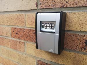 a soap dispenser attached to a brick wall at Budget Base Apartment - 3 x Einzelzimmer in Braunschweig