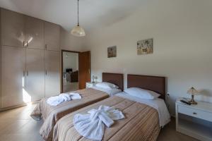 Posteľ alebo postele v izbe v ubytovaní Lila Villas
