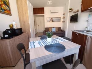 a kitchen with a table and chairs in a room at Mondello Sea House in Palermo