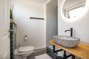 a bathroom with a sink and a toilet at Meer in Sicht in Eckernförde