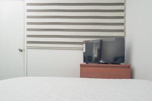 Postel nebo postele na pokoji v ubytování Innovar Casa Hostal