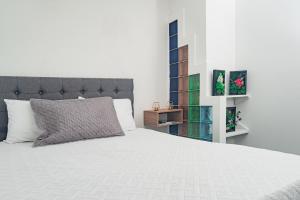 Postel nebo postele na pokoji v ubytování Innovar Casa Hostal