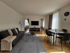 a living room with a couch and a table at There is no planet like E Planet in Järfälla