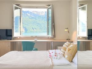 Ein Bett oder Betten in einem Zimmer der Unterkunft Seehotel Schwert